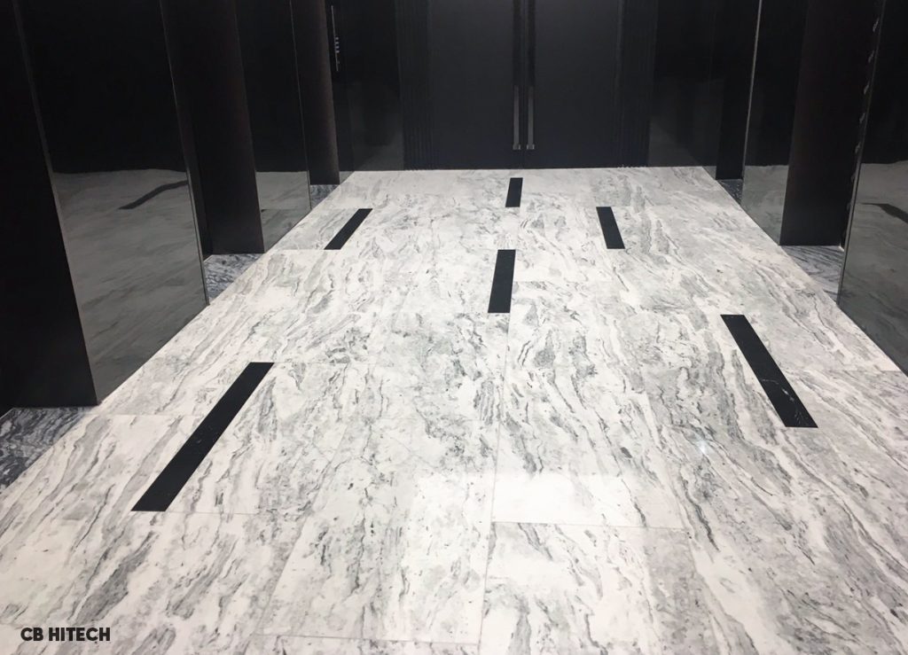 Sảnh thang máy Trụ sở tập đoàn Thành Công lát bằng đá marble trắng. Nguồn ảnh của CB Hitech